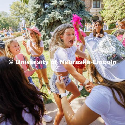 A jubilant new member of the Delta Gamma sorority. Sorority Bid Day in the Cather Dining Complex and on the Vine Street Fields. August 19, 2023. Photo by Craig Chandler / University Communication.