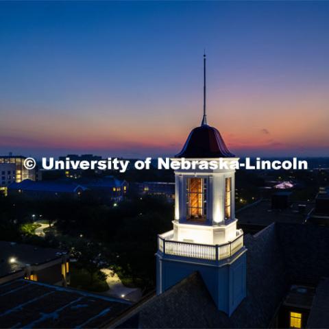 The cupola on Love Library glows at dawn as the sun rises on the First day of classes of fall semester. August 21, 2023 Photo by Craig Chandler / University Communication. 