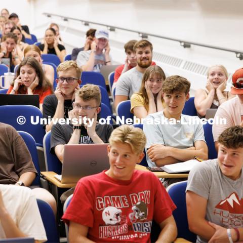 Chemistry 109 began the new school year with a bang. Each lecture demonstrated how atoms can combine in different molecules. Hydrogen and oxygen can make water but can also combine to make an explosive gas. Students in Shuo Sun’s lecture react as his first lecture with a bang by exploding a balloon filled with a H2O2 gas using a candle taped to a long stick. First day of classes for fall semester. August 21, 2023. Photo by Craig Chandler / University Communication.