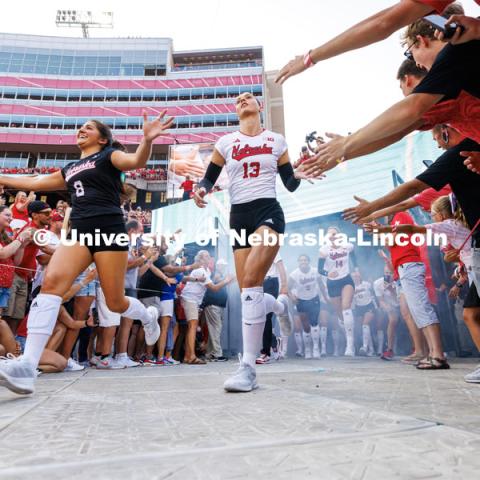 Lexi Rodriguez and Merritt Beason lead the team out of the tunnel walk. Volleyball Day in Nebraska. Husker Nation stole the show on Volleyball Day in Nebraska. The announced crowd of 92,003 surpassed the previous world record crowd for a women’s sporting event of 91,648 fans at a 2022 soccer match between Barcelona and Wolfsburg. Nebraska also drew the largest crowd in the 100-year history of Memorial Stadium for Wednesday’s match. August 30, 2023. Photo by Craig Chandler / University Communication.