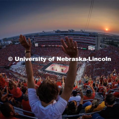 The crowd does the wave during a time out as the sun sets over Memorial Stadium. Volleyball Day in Nebraska. Husker Nation stole the show on Volleyball Day in Nebraska. The announced crowd of 92,003 surpassed the previous world record crowd for a women’s sporting event of 91,648 fans at a 2022 soccer match between Barcelona and Wolfsburg. Nebraska also drew the largest crowd in the 100-year history of Memorial Stadium for Wednesday’s match. August 30, 2023. Photo by Craig Chandler / University Communication.