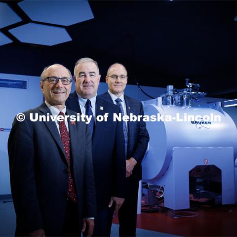 (From left) David Berkowitz of the University of Nebraska–Lincoln, Rick Evans of the National Strategic Research Institute and Ken Bayles of the University of Nebraska Medical Center have received a $24.5 million award from the Defense Health Agency to advance development of an acute radiation syndrome prophylactic. They are shown with UNL’s new 15-Tesla ICR-MS instrument in Hamilton Hall. August 31, 2023. Photo by Craig Chandler / University Communication.