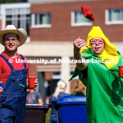 Sean Cuthbert, tosses a bag as he and Mitchel Brever, play corn hole at the Student Tailgate in the greenspace north of the Nebraska Union. Nebraska vs. Northern Illinois football in Memorial Stadium. September 16, 2023. Photo by Craig Chandler / University Communication.