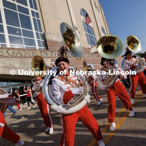 Sousaphone section of the Cornhusker Marching Band dances their way into the stadium. Northern Illinois football in Memorial Stadium. September 16, 2023. Photo by Craig Chandler / University Communication.