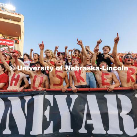 Husker fans in the Boneyard section sing the Scarlet and Cream song. Northern Illinois football in Memorial Stadium. September 16, 2023. Photo by Craig Chandler / University Communication.