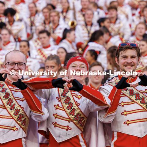 Members of the Husker Marching Band make hearts for the football team. Northern Illinois football in Memorial Stadium. September 16, 2023. Photo by Craig Chandler / University Communication.