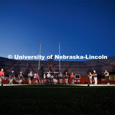 The drum line practices during their 6:30 am section practice before the full band practice. Cornhusker Marching Band early morning practice. September 19, 2023. Photo by Craig Chandler / University Communication.