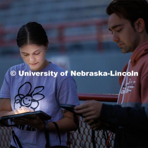 Vilynn Decker and the other drum majors go over their music before practice. Cornhusker Marching Band early morning practice. September 19, 2023. Photo by Craig Chandler / University Communication.