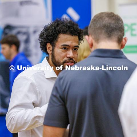 Eldwin Caballero talks with a recruiter for Kiewit at the Career Fair in the Nebraska Union. September 20, 2023. Photo by Craig Chandler / University Communication.