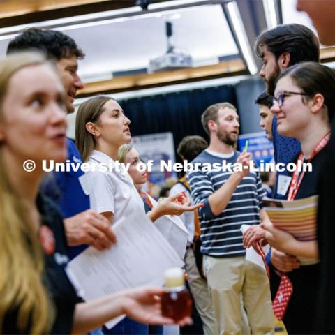 Recruiters including Tessa Yackley, a civil engineer with Olsson who stepped away from her engineering duties to help recruit, line up to talk with students about career opportunities. Career Fair in the Nebraska Union. September 20, 2023. Photo by Craig Chandler / University Communication.