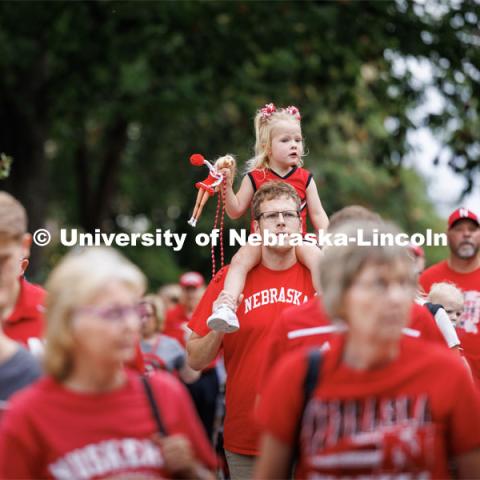 A young Husker fan brings her Barbie as she heads to the stadium on her dad’s shoulders. Nebraska football vs. Louisiana Tech. August 23, 2023. Photo by Craig Chandler/ University Communication.