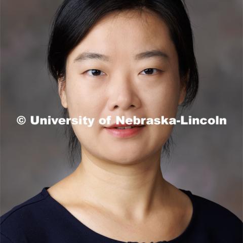 Studio portrait of Jing Wang, Assistant Professor, Special Education and Communication Disorders. September 27, 2023. Photo by Craig Chandler / University Communication.