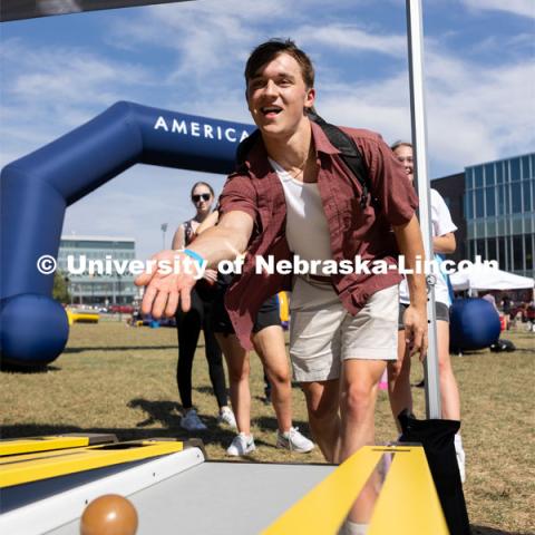 Keaton Clark plays skee-ball at Hanging with the Huskers event. September 29, 2023. Photo by Dillon Galloway for University Communications.