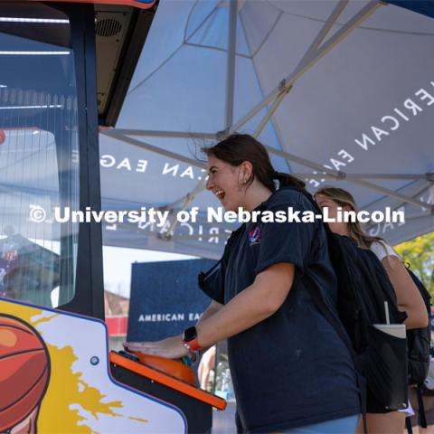 Frances Haugh plays with a basketball mini game at Hanging with the Huskers event. September 29, 2023. Photo by Dillon Galloway for University Communications.