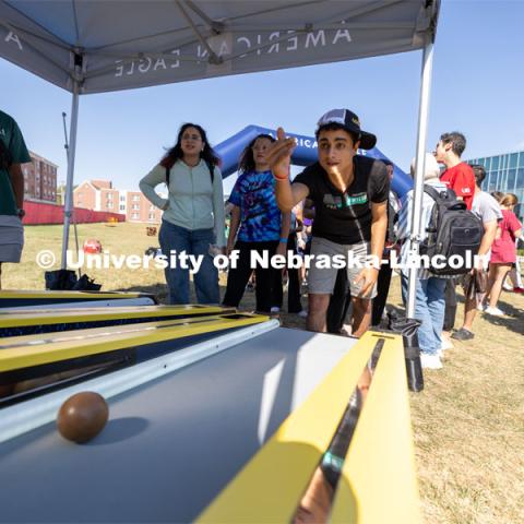 Gary Elias plays skee-ball at Hanging with the Huskers event. September 29, 2023. Photo by Dillon Galloway for University Communications.