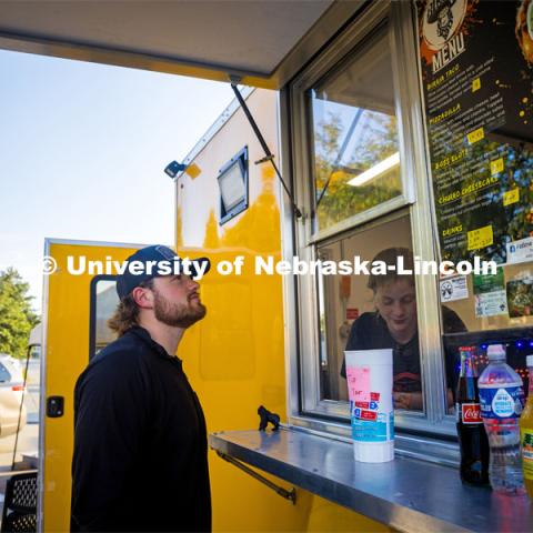 Ordering tacos at the Birria Boss Taco truck at the Hub and Soul Event. September 29, 2023. Photo by Kristen Labadie / University Communication.