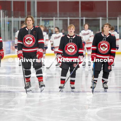 Hockey players at the starting lineup Friday night. Husker Hockey at Breslow Ice Hockey Center. October 7, 2023. Photo by Dillon Galloway for University Communication and Marketing.