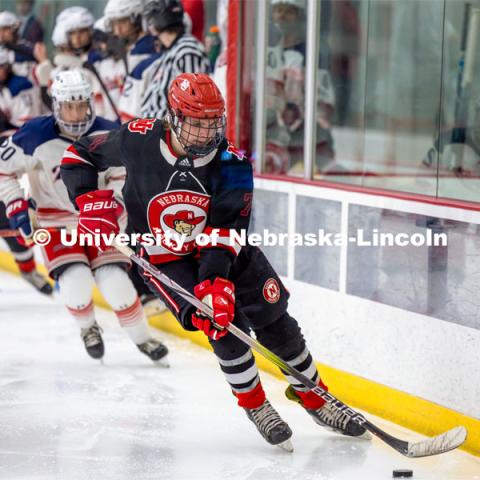 Dylan Mcrae Forward #74 moves the puck down the ice. Husker Hockey at Breslow Ice Hockey Center. October 7, 2023. Photo by Dillon Galloway for University Communication and Marketing.