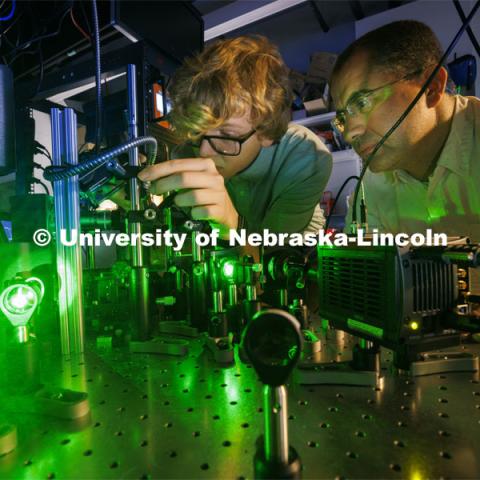 Ben Hammons, a freshman in electrical engineering, and Abdelghani Laraoui, Assistant Professor in Mechanical and Materials Engineering, work on their laser equipment. Laraoui is working to find materials that would improve the performance of quantum computing. To do this, they need to create an environment that is super cold – talking close to zero Kelvin. Laraoui said the NSF money, in part, is helping to fund the purchase of a state-of-the-art MRI that creates such cold environments. It would make UNL one of the few places in the US that this type of research could take place. October 12, 2023. Photo by Craig Chandler / University Communication.
