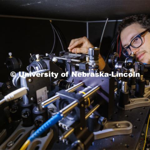 Adam Erickson, graduate student in engineering, works with his laser experiment in the Laraoui lab. Abdelghani Laraoui, is working to find materials that would improve the performance of quantum computing. To do this, they need to create an environment that is super cold – talking close to zero Kelvin. Laraoui said the NSF money, in part, is helping to fund the purchase of a state-of-the-art MRI that creates such cold environments. It would make UNL one of the few places in the US that this type of research could take place. October 12, 2023. Photo by Craig Chandler / University Communication.