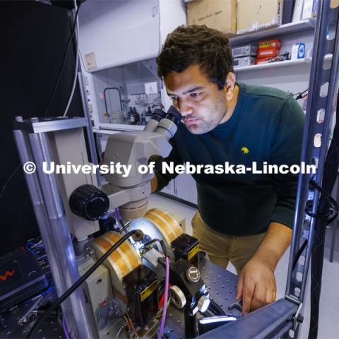 Rupak Timalsina, graduate student in engineering, works with his laser experiment in the Laraoui lab. Abdelghani Laraoui, is working to find materials that would improve the performance of quantum computing. To do this, they need to create an environment that is super cold – talking close to zero Kelvin. Laraoui said the NSF money, in part, is helping to fund the purchase of a state-of-the-art MRI that creates such cold environments. It would make UNL one of the few places in the US that this type of research could take place. October 12, 2023. Photo by Craig Chandler / University Communication.