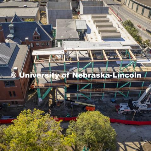 Construction on the new addition to Architecture Hall is underway. Working on installing the fourth level, mass timber columns and beams which are between 2,000 and 3,000 lbs. The @hdr_inc & @nadaaainc design is being built with @timberlynegroup #CLT and #gluelam, all implemented by Whiting-Turner. This new addition will add 14 new studios among other amenities.  October 19, 2023. Photo by Craig Chandler / University Communication.