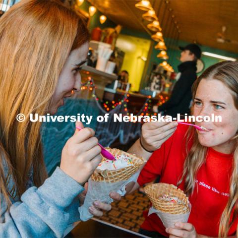 Hannah-Kate Kinney and Cora Scott enjoying Ivanna Cone ice cream. October 20, 2023. Photo by Matthew Strasburger / University Communication.