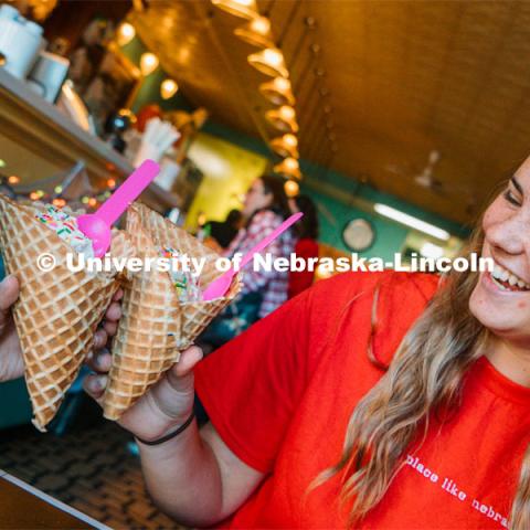 Cora Scott enjoys a waffle cone at Ivanna Cone. About Lincoln at Ivanna Cone in the Haymarket. October 20, 2023. Photo by Matthew Strasburger / University Communication.