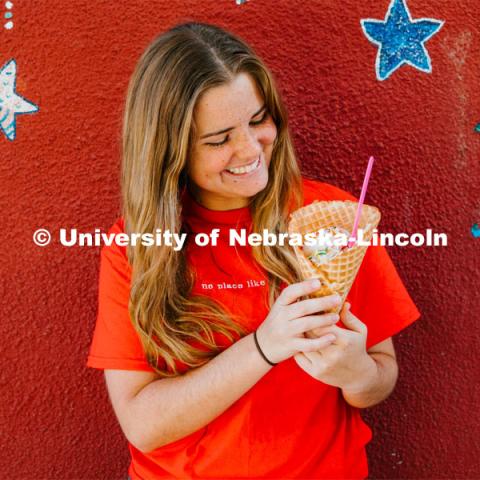 Cora Scott enjoys a waffle cone at Ivanna Cone. About Lincoln at Ivanna Cone in the Haymarket. October 20, 2023. Photo by Matthew Strasburger / University Communication.