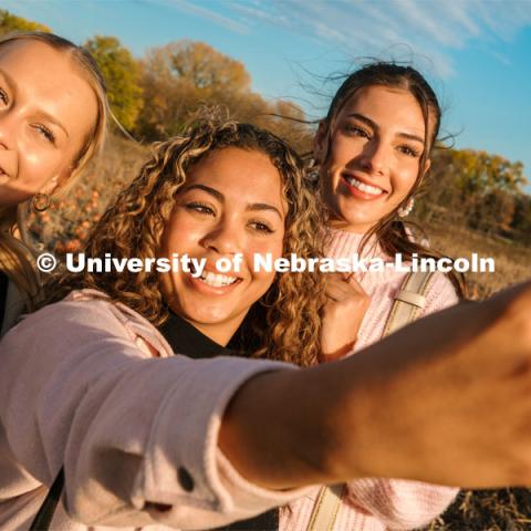 Husker Cheer Squad take a selfie at Roca Berry Farm. About Lincoln at Roca Berry Farm. October 22, 2023. Photo by Matthew Strasburger / University Communication.