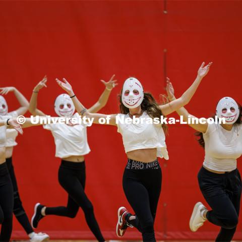 Team 12: Beta Theta Pi, Theta Chi, Delta Delta Delta, Pi Alpha Chi perform wearing white masks. Showtime at the Coliseum. Recognized Student Organizations, Greeks and Residence Halls battle against each other with performances for Homecoming competition points and ultimate bragging rights. Homecoming 2023. October 23, 2023. Photo by Craig Chandler / University Communication.