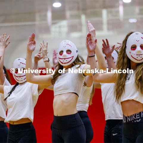 Team 12: Beta Theta Pi, Theta Chi, Delta Delta Delta, Pi Alpha Chi perform wearing white masks. Showtime at the Coliseum. Recognized Student Organizations, Greeks and Residence Halls battle against each other with performances for Homecoming competition points and ultimate bragging rights. Homecoming 2023. October 23, 2023. Photo by Craig Chandler / University Communication.