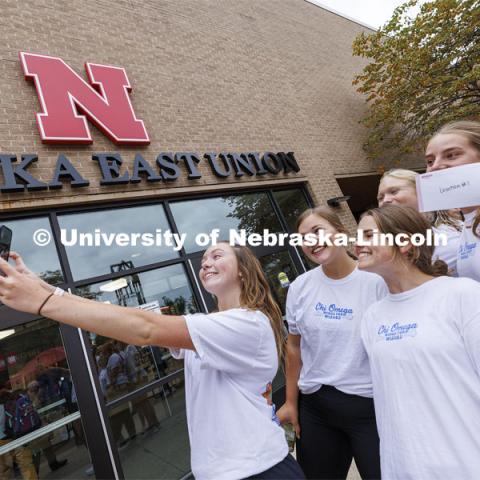 Team Chi Omega takes a selfie in front of the Nebraska East Union before beginning the race. Homecoming Traditions Race. Registered teams compete in a race to find 10 landmarks in an hour on UNL’s East Campus. October 24, 2023. Photo by Craig Chandler / University Communication.