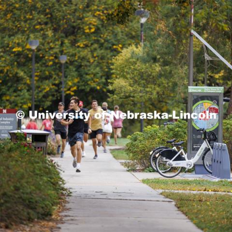 Teams run across East Campus trying to find clues. Homecoming Traditions Race. Registered teams compete in a race to find 10 landmarks in an hour on UNL’s East Campus. October 24, 2023. Photo by Craig Chandler / University Communication.