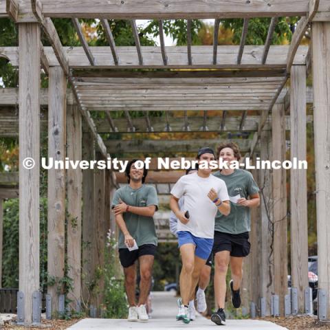 The Pike team runs through the Maxwell Arboretum. Homecoming Traditions Race. Registered teams compete in a race to find 10 landmarks in an hour on UNL’s East Campus. October 24, 2023. Photo by Craig Chandler / University Communication.