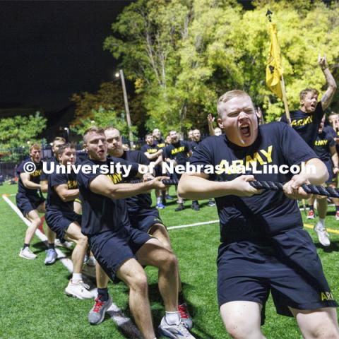 Army cadet Jacob Lang lets out a roar as the Army won their tug. ROTC Joint Field Meet is like an ROTC Olympics for the Nebraska cadets and midshipmen. Army, Air Force and Navy/Marine cadets and midshipmen compete in events such as Maneuvering Under Fire, Log Sit-ups, Tug-Of-War, Casualty Evacuation and Ultimate Frisbee. Army beat Navy in a sudden death 4x400 relay to claim the title. October 26, 2023. Photo by Craig Chandler / University Communication.