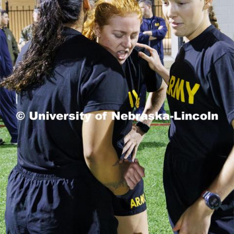 Army cadet Michaela Guzman catches her breath after the casualty evacuation race. The race has each branch run a timed 220 yard race on the Mabel Lee field for the male and female cadets and midshipman. ROTC Joint Field Meet is like an ROTC Olympics for the Nebraska cadets and midshipman. Army, Air Force and Navy/Marine cadets compete in events such as Maneuvering Under Fire, Log Sit-ups, Tug-Of-War, Casualty Evacuation and Ultimate Frisbee. Army beat Navy in a sudden death 4x400 relay to claim the title. October 26, 2023. Photo by Craig Chandler / University Communication.