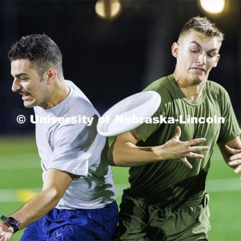 Air Force, left, and Navy have a mid-air collision during their Ultimate Frisbee competition. ROTC Joint Field Meet is like an ROTC Olympics for the Nebraska cadets and midshipman. Army, Air Force and Navy/Marine cadets and midshipman compete in events such as Maneuvering Under Fire, Log Sit-ups, Tug-Of-War, Casualty Evacuation and Ultimate Frisbee. Army beat Navy in a sudden death 4x400 relay to claim the title. October 26, 2023. Photo by Craig Chandler / University Communication.