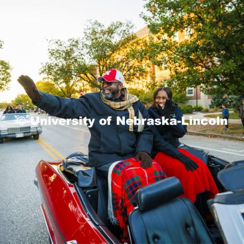 Chancellor Rodney Bennett and his wife, Temple, wave to the crowd as they roll down R Street. Homecoming parade and Cornstock. October 27, 2023. Photo by Craig Chandler / University Communication.