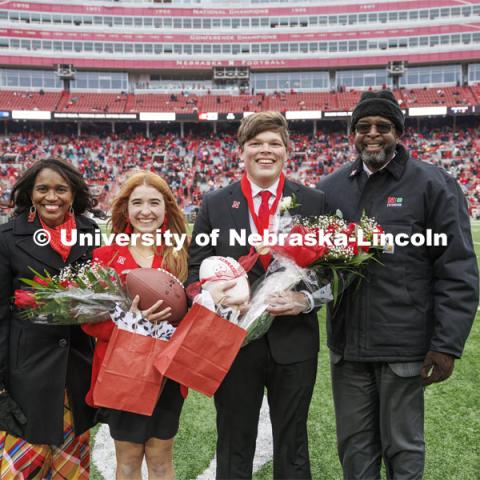 Seniors Hannah-Kate Kinney of Omaha and Preston Kotik of Hooper have been crowned homecoming royalty at the University of Nebraska–Lincoln. Chancellor Rodney Bennett, right, and his wife, Temple, presented them with their gifts at the halftime ceremony. Nebraska football versus Purdue Homecoming game. October 28, 2023. Photo by Craig Chandler / University Communication.
