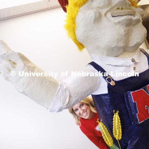 Ashley Dohe, Administrative Coordinator for Electrical and Computer Engineering, has made an 8-foot tall Herbie Husker from paper- mâché. She hopes to auction it off to help veterans. October 30, 2023. Photo by Craig Chandler / University Communication.