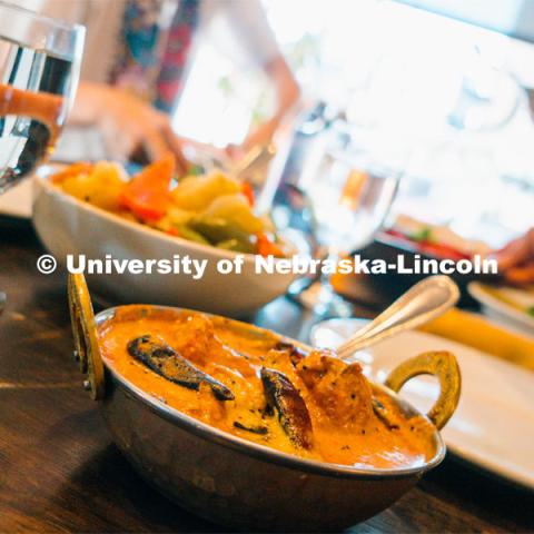 Bowls of Indian food at The Oven restaurant in the Haymarket. About Lincoln at The Oven. November 2, 2023. Photo by Matthew Strasburger / University Communication.