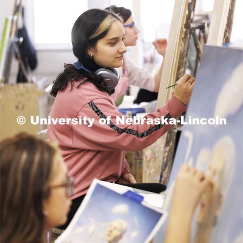 Lizeth Lopez-Garcia, a sophomore from Crete, works on her master study painting in Aaron Holz’ PANT 251: Beginning Painting course in Richards Hall. November 29, 2023. Photo by Craig Chandler / University Communication and Marketing.