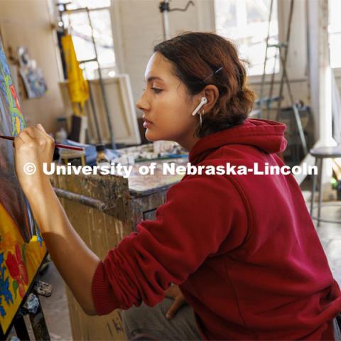 Lilliana Baez-Leonard, a sophomore from Omaha, works on her master study painting in Aaron Holz’ PANT 251: Beginning Painting course in Richards Hall. November 29, 2023. Photo by Craig Chandler / University Communication and Marketing.