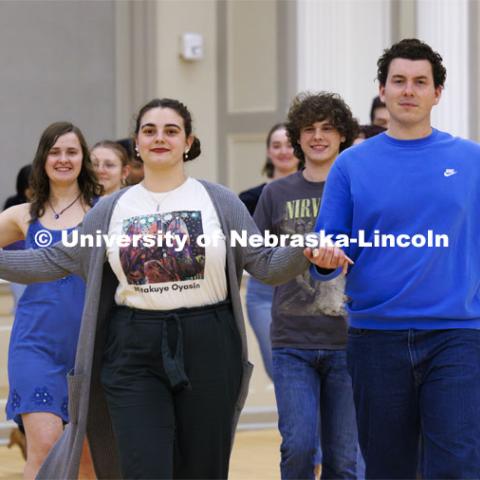 A group parades onto the floor. Ballroom Dancing Club works through their final practice in the Nebraska Union Ballroom Thursday night before Saturday’s show. December 7, 2023. Photo by Craig Chandler / University Communication and Marketing.