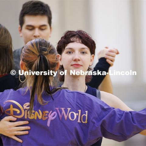 Lyndi Weber dances Atley Van Emmerik across the ballroom. Ballroom Dancing Club works through their final practice in the Nebraska Union Ballroom Thursday night before Saturday’s show. December 7, 2023. Photo by Craig Chandler / University Communication and Marketing.