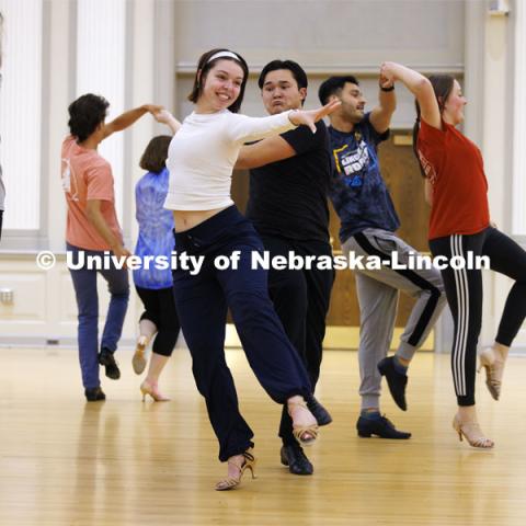 Grace Thomsen and Calen Bernbeck do a quick-step dance with the gold group. Ballroom Dancing Club works through their final practice in the Nebraska Union Ballroom Thursday night before Saturday’s show. December 7, 2023. Photo by Craig Chandler / University Communication and Marketing.