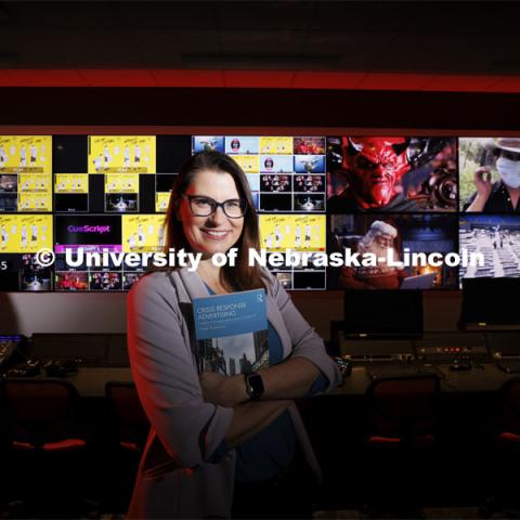 Frauke Hachtmann, Professor in Advertising, has published her research on Complex Crisis Response Advertising using examples of COVID-19 advertising as seen on the video screens in the CoJMC production studio. December 7, 2023. Photo by Craig Chandler / University Communication and Marketing.