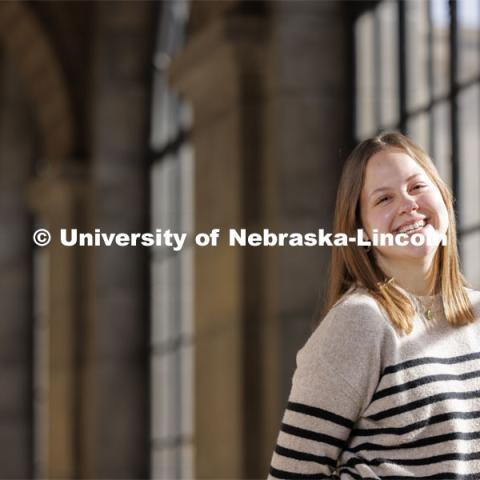 Francie Heeren, junior in political science and ethnic studies, attends UNL with a scholarship from The Nebraska Promise program. The program covers undergraduate tuition at the University of Nebraska's four campuses (UNK, UNL, UNMC and UNO) and its two-year technical college (NCTA). Heeren is photographed in different areas of the State Capitol. December 13, 2023. Photo by Craig Chandler / University Communication and Marketing.