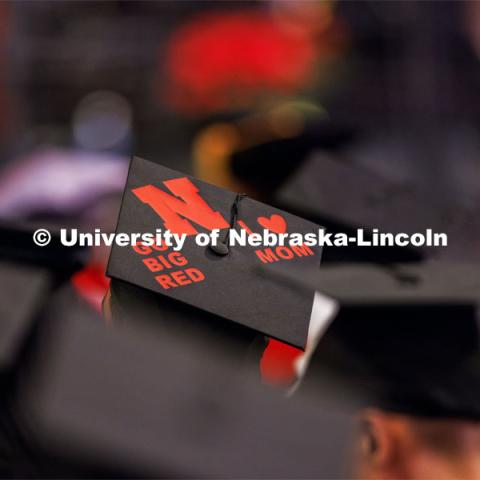 Alex Fernando listens to the ceremony as he awaits his MBA. Graduate Commencement at Pinnacle Bank Arena. December 15, 2023. Photo by Craig Chandler / University Communication and Marketing.